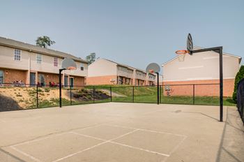 a basketball court in front of a building